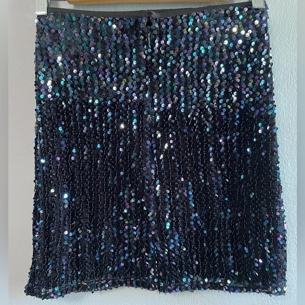 Molly Bracken multi color sequins black mini skirt. Size XS.